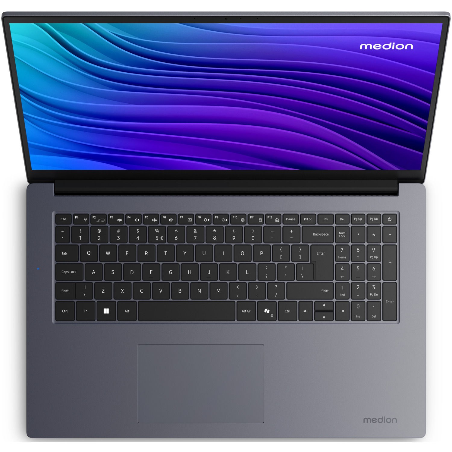Un ordinateur portable Medion argenté, ouvert, avec clavier et pavé tactile visibles. L'écran affiche un motif ondulé bleu et violet.