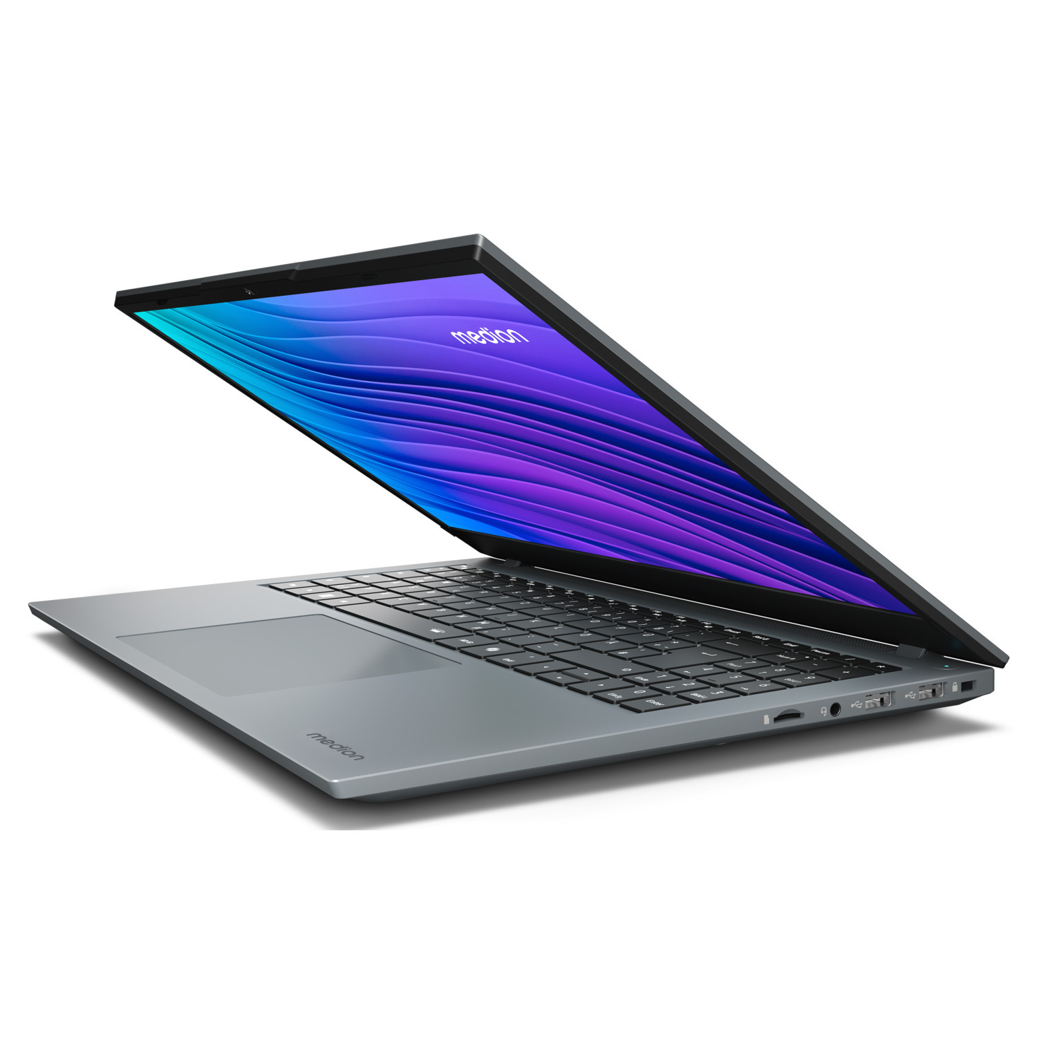 Un ordinateur portable gris est ouvert, affichant un écran violet et bleu. Le clavier est visible et l'ordinateur est sur une surface blanche.