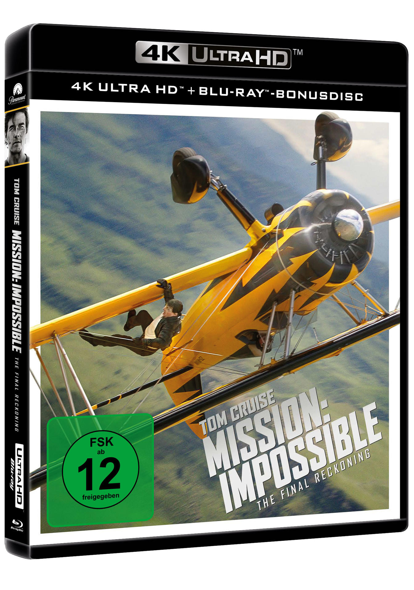 Filmcover von Mission: Impossible. Tom Cruise hängt an einem gelb-schwarzen Doppeldecker. Der Hintergrund ist ein grüner und blauer Himmel.