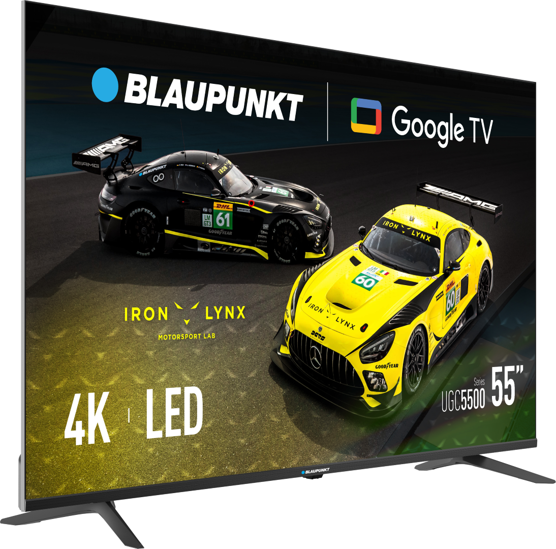 Telewizor Blaupunkt 55" wyświetla dwa samochody wyścigowe. Żółty samochód z numerem 60 i czarny samochód z numerem 61 na torze wyścigowym.