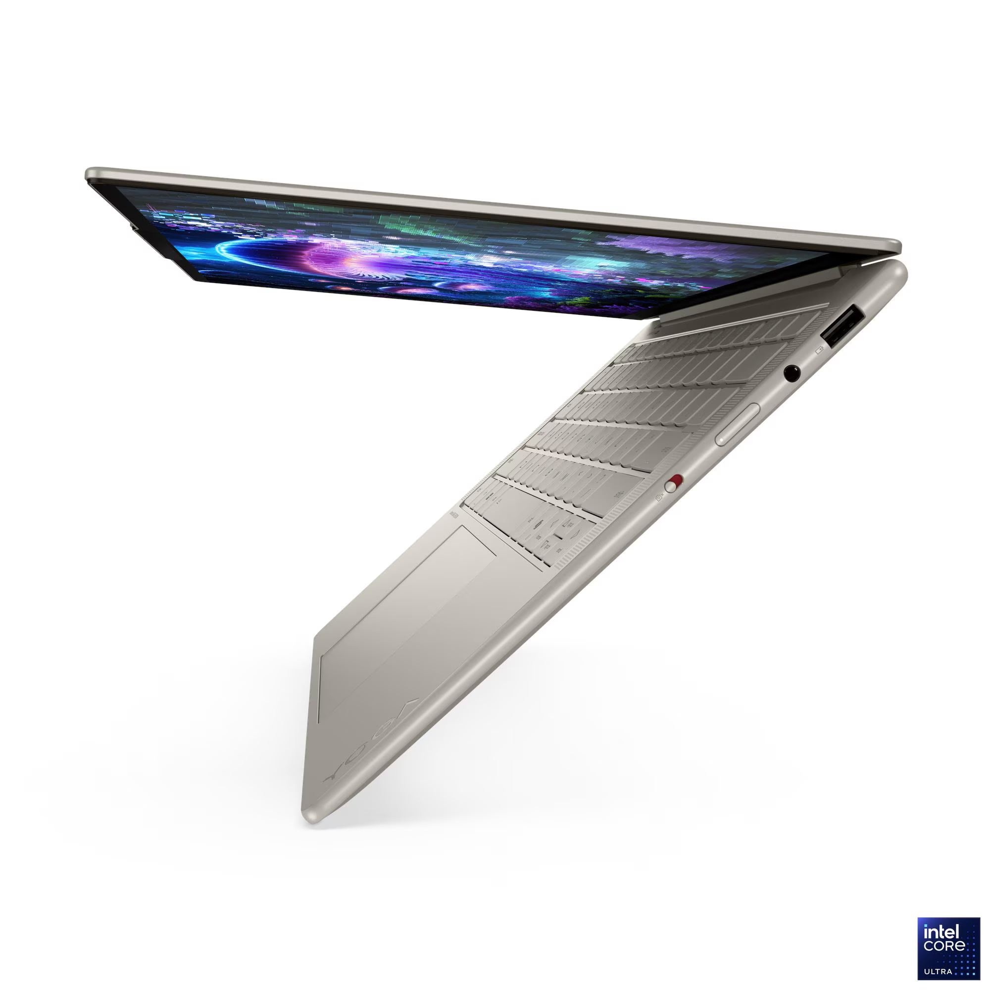 Bézs laptop, nyitott képernyő, színes absztrakt grafikákkal. Billentyűzet látható. Intel Core Ultra jelvény jobb alsó sarokban.