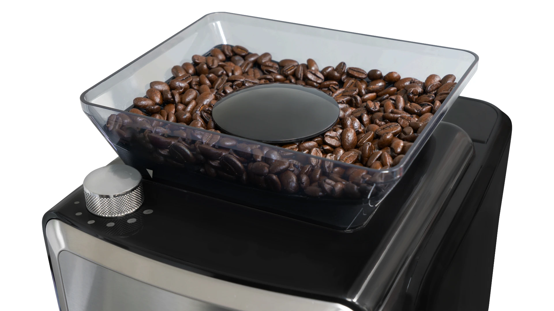 Młynek do kawy z przezroczystym pojemnikiem wypełnionym ziarnami kawy. Czarna pokrywa i pokrętło są widoczne na górze młynka.