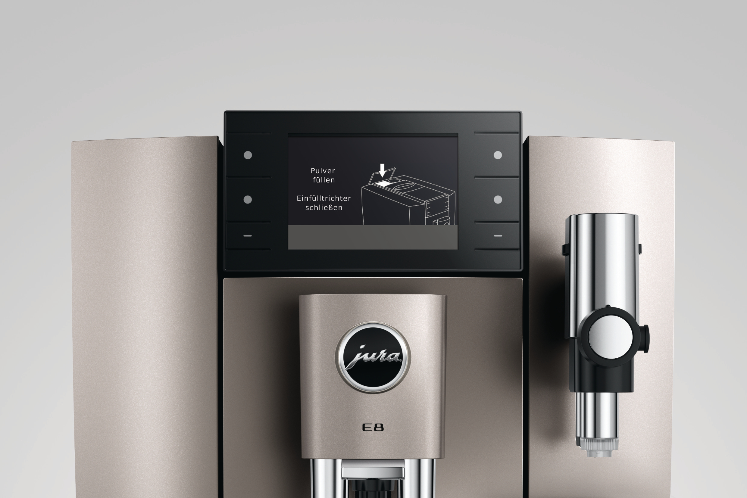 Eine Kaffeemaschine zeigt Anweisungen auf einem Bildschirm. Die Maschine hat ein silbernes und schwarzes Design.