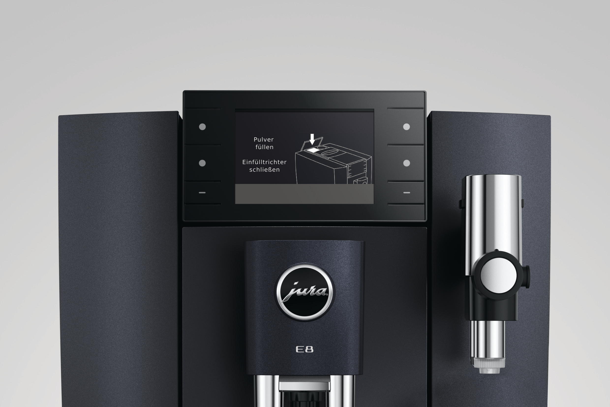 Schwarze Jura E8 Kaffeemaschine mit Display, das Anweisungen zeigt, und Chromelementen.