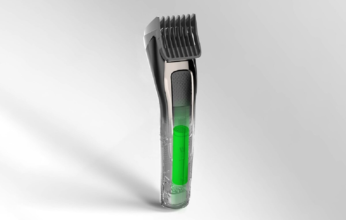 Przezroczysta golarka elektryczna, pokazująca wewnętrzny zielony akumulator. Golarka jest szara i czarna z osłoną ostrza.