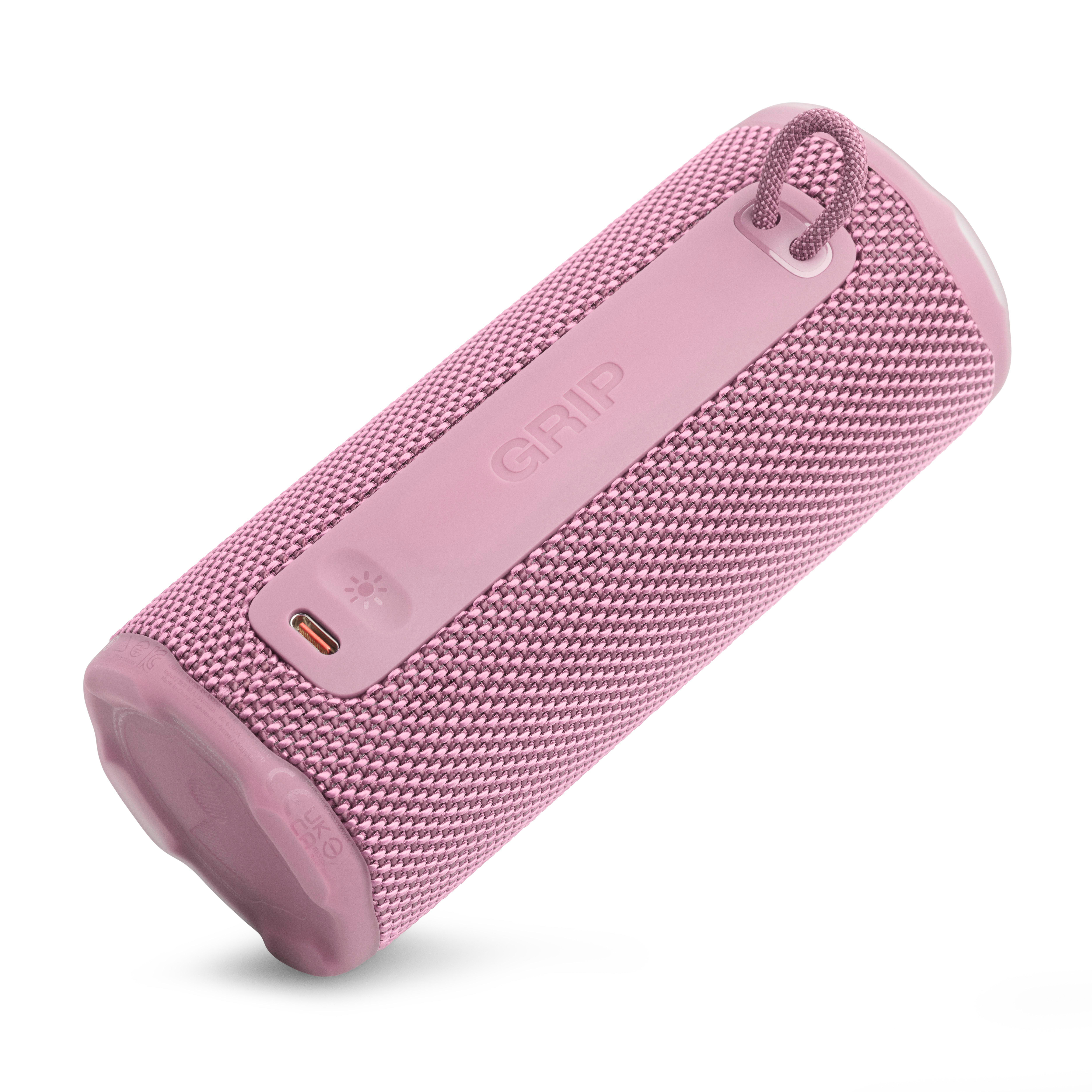 Ein rosa zylindrischer Lautsprecher mit 'GRIP'. Es hat eine gewebte Textur und eine Schlaufe. Der Hintergrund ist weiß.