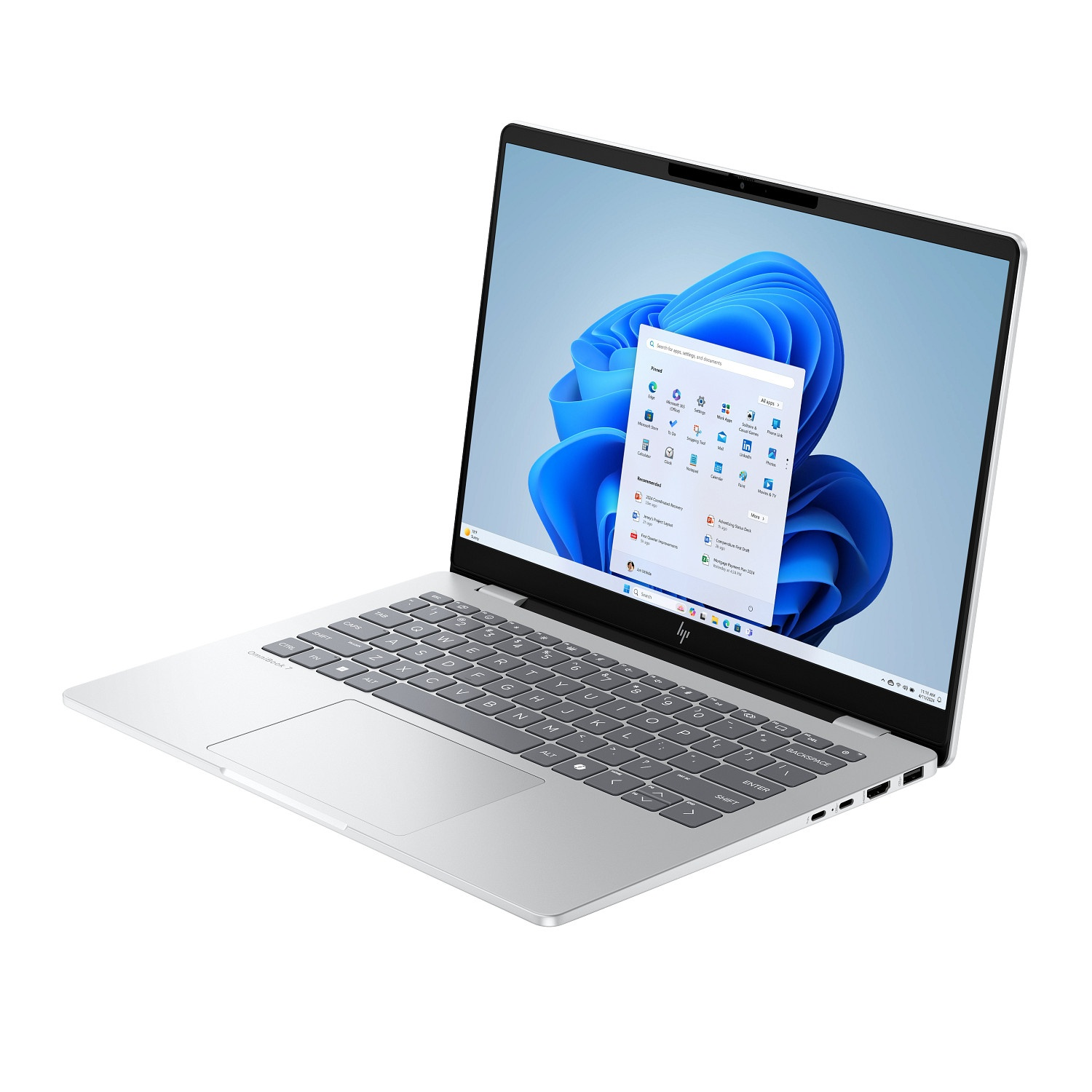 A silver HP laptop is open, displaying the Windows 11 home screen with app icons and a blue abstract background.