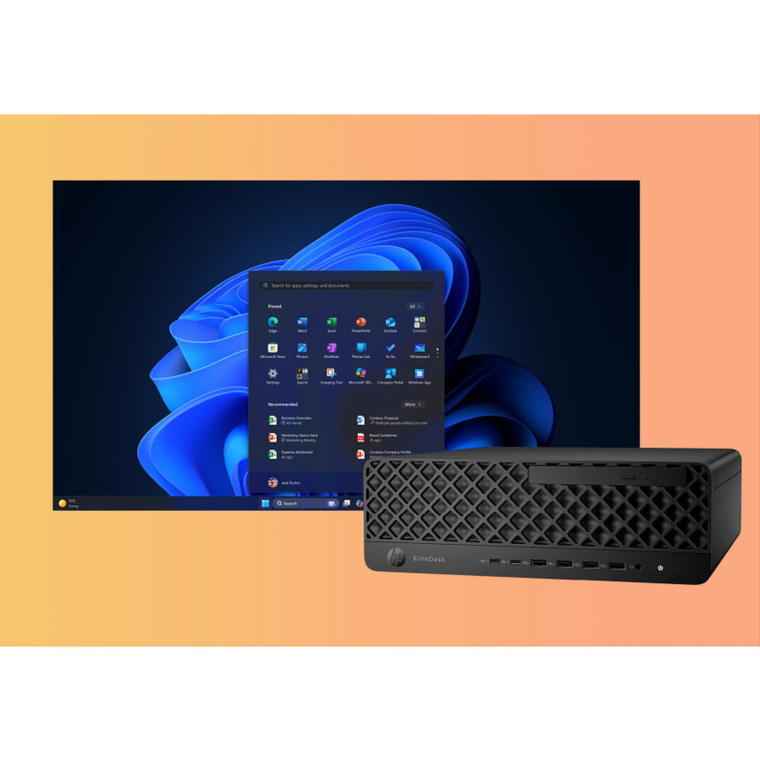 Desktop PC with Windows 11 interface. Black computer case on an orange background. The screen displays apps and settings.