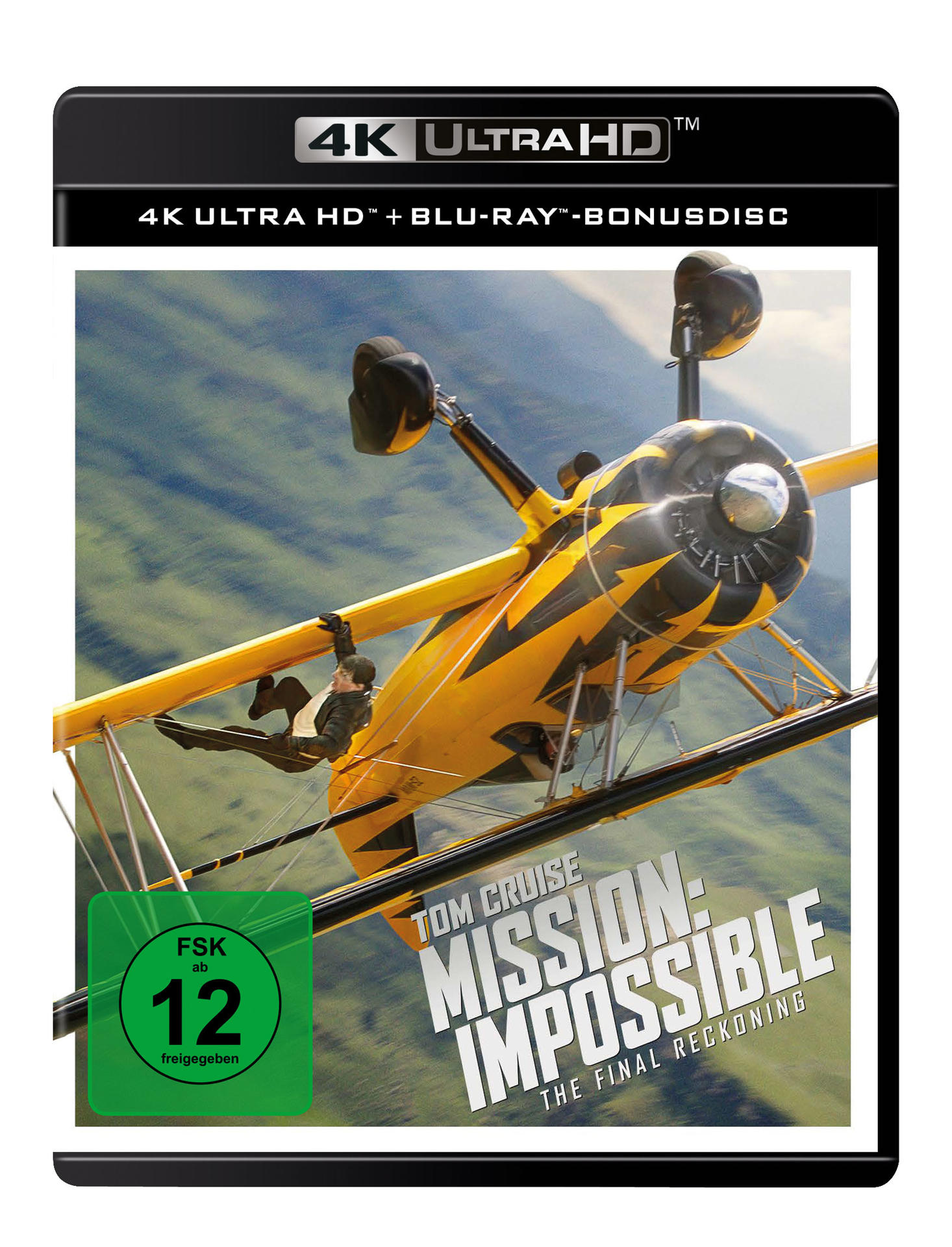 Filmcover mit Tom Cruise, der an einem gelben Doppeldecker hängt. Titel: Mission Impossible, The Final Reckoning. Bewertung: FSK ab 12.