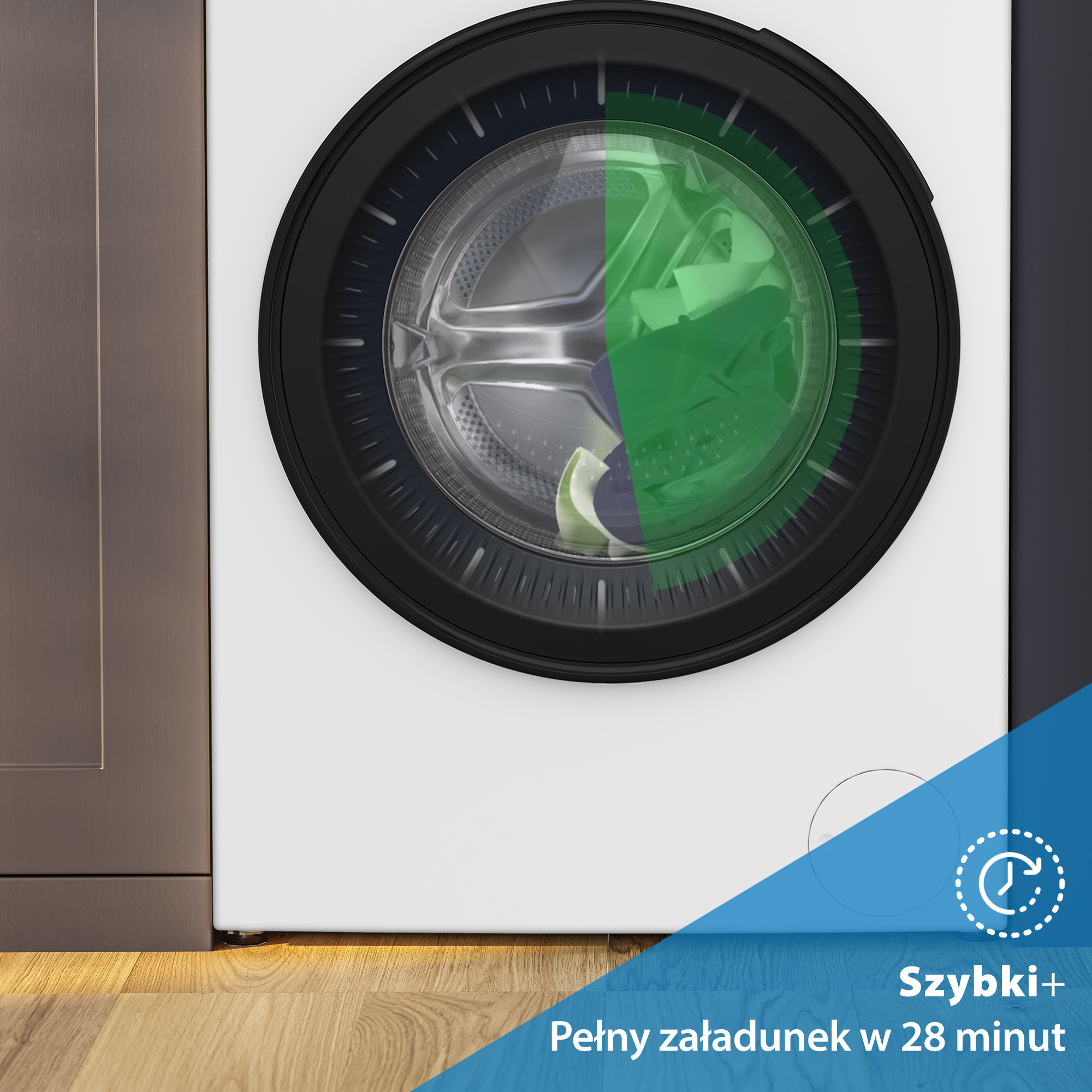 Pralka z czarną obwódką i zielonymi ubraniami w środku. Tekst na dole mówi: Szybki+ Pełny załadunek w 28 minut.