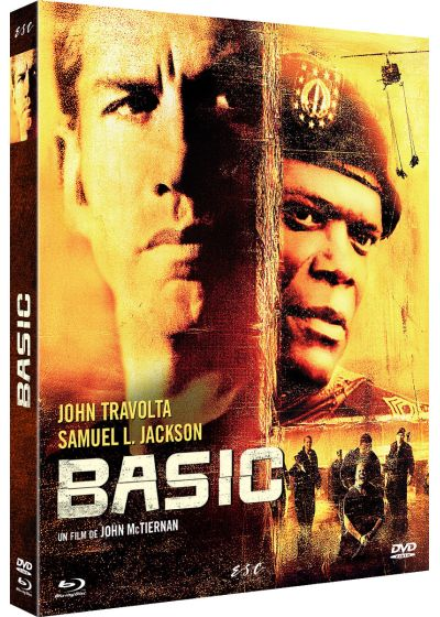 DVD-hoes van de film 'Basic'. Met John Travolta en Samuel L. Jackson. Toont twee gezichten met de titel van de film. Het heeft een gele en rode achtergrond.