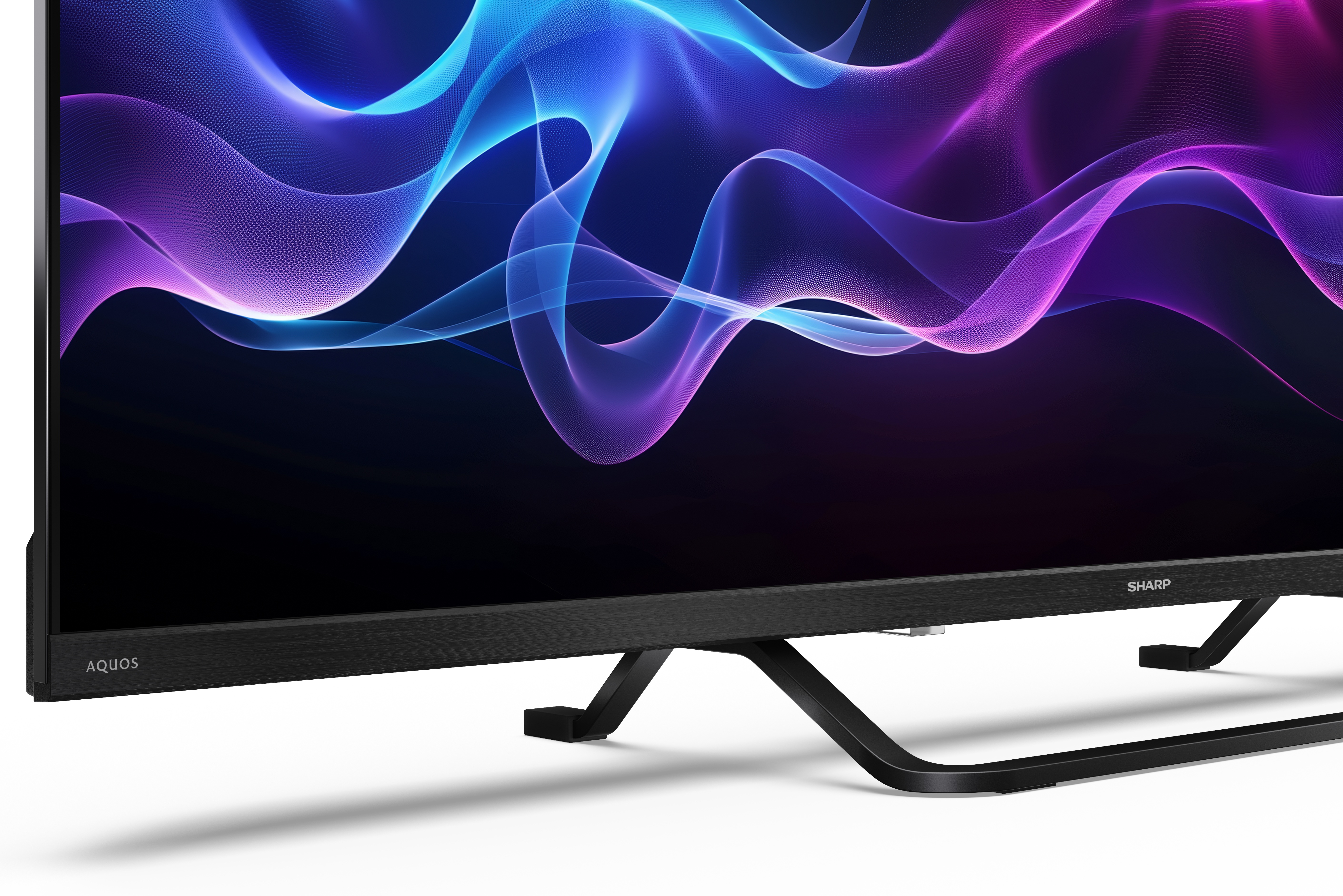 Czarny telewizor Sharp Aquos z abstrakcyjnymi niebieskimi i fioletowymi falami na ekranie.