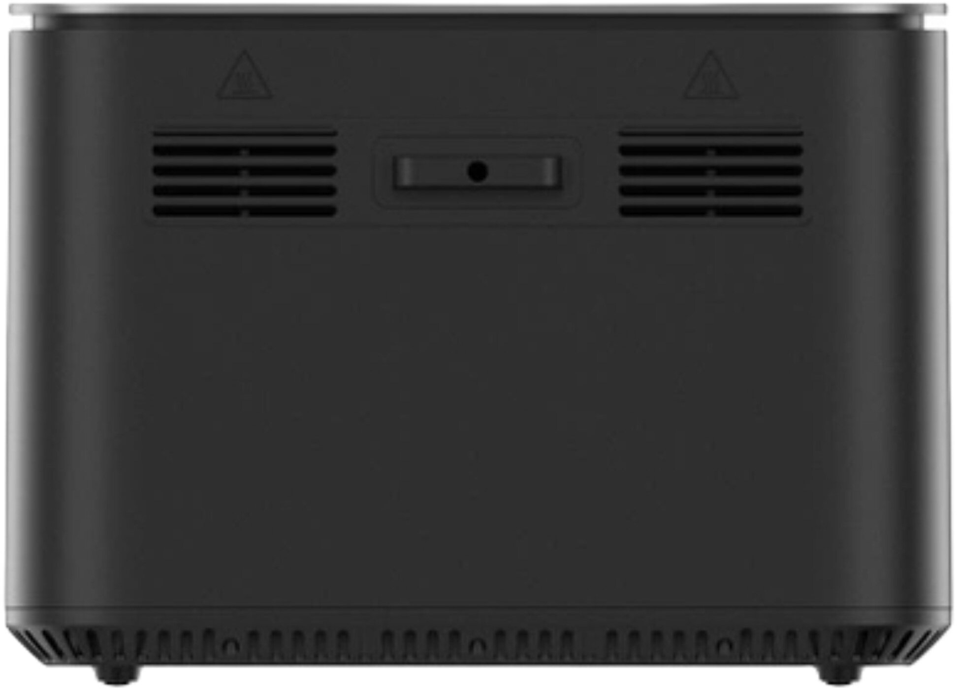 Czarne urządzenie z kratkami wentylacyjnymi, przyciskiem i symbolami ostrzegawczymi. Spód ma małe nóżki. Góra to srebrna krawędź.