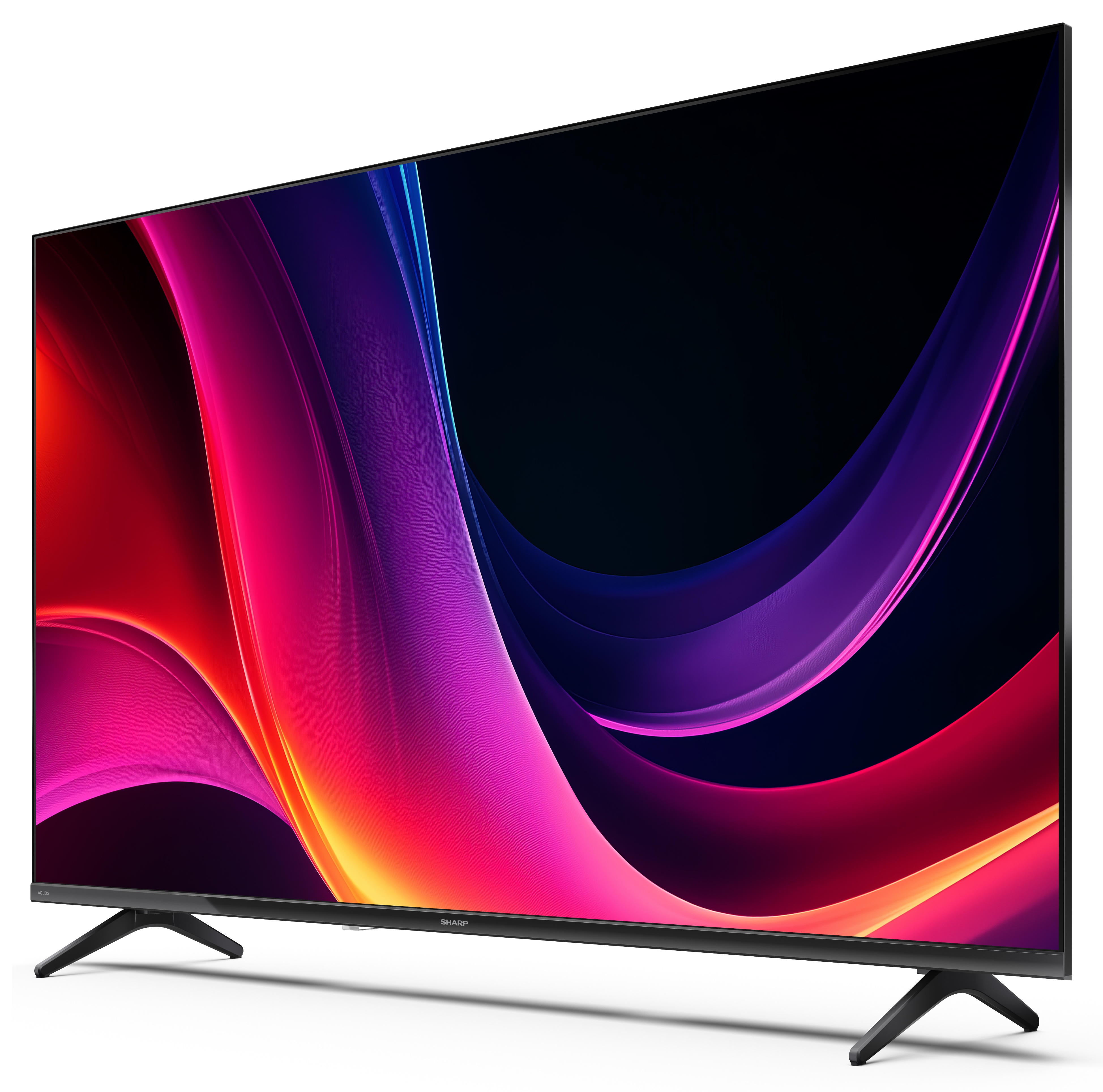 Pochylony telewizor wyświetla kolorowe abstrakcyjne kształty. Ma czarne nogi i czarną ramę. Tło jest białe.