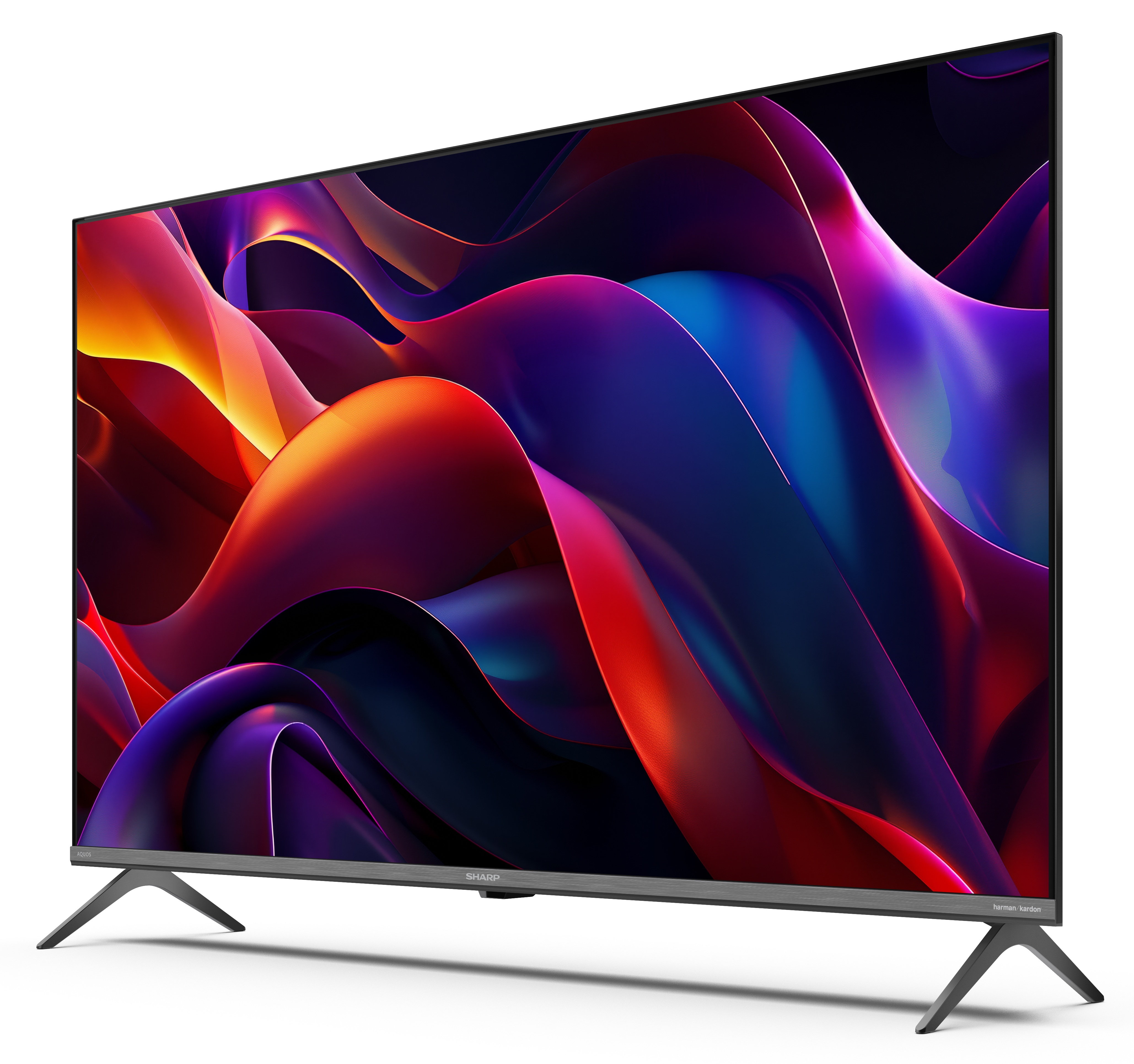 Telewizor Sharp wyświetla kolorowy abstrakcyjny wzór. Telewizor ma szare nóżki i czarną ramkę. Tło jest białe.