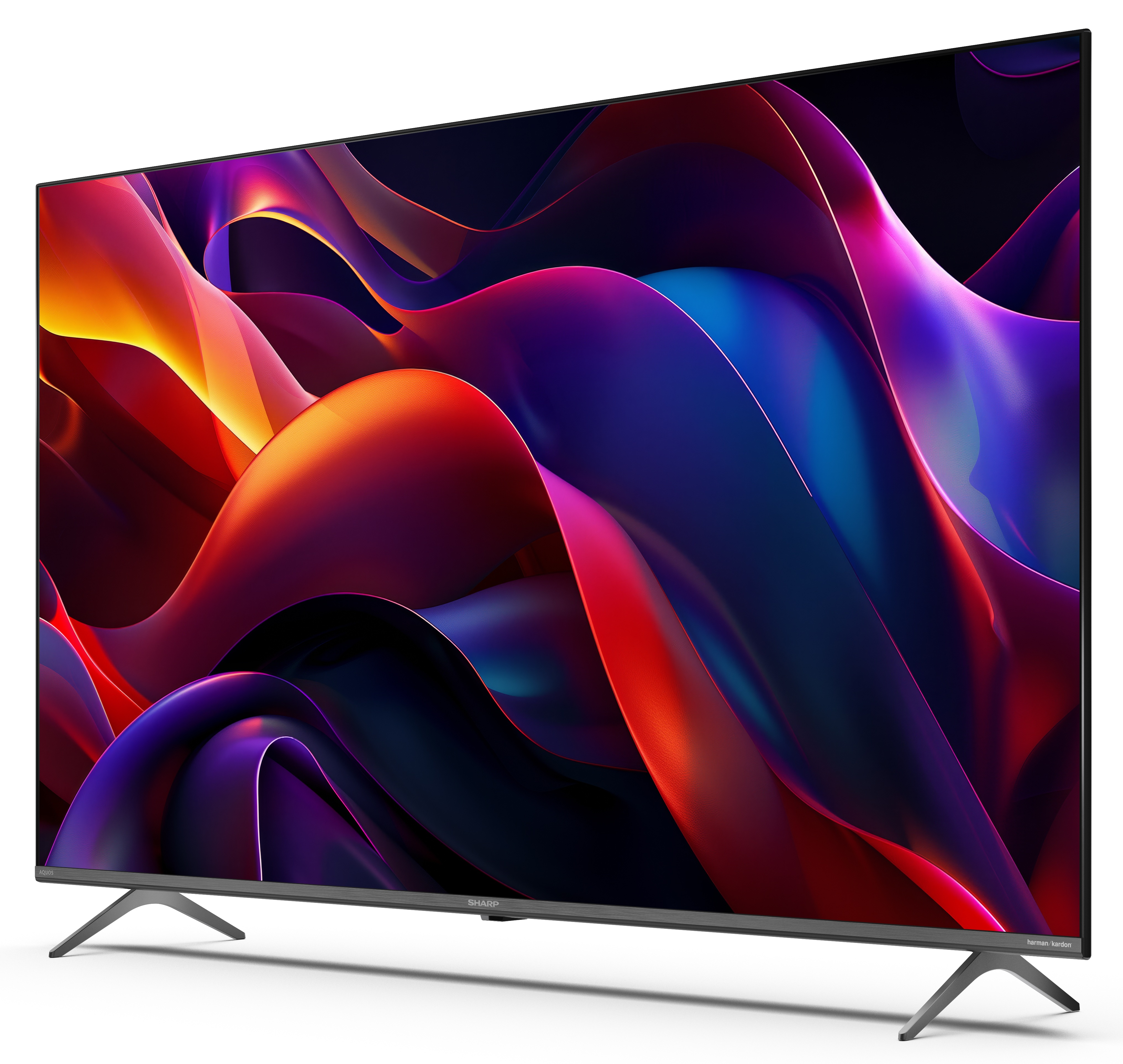 Telewizor Sharp wyświetla kolorowy abstrakcyjny wzór. Telewizor ma szare nóżki i czarną ramę, na białej powierzchni.