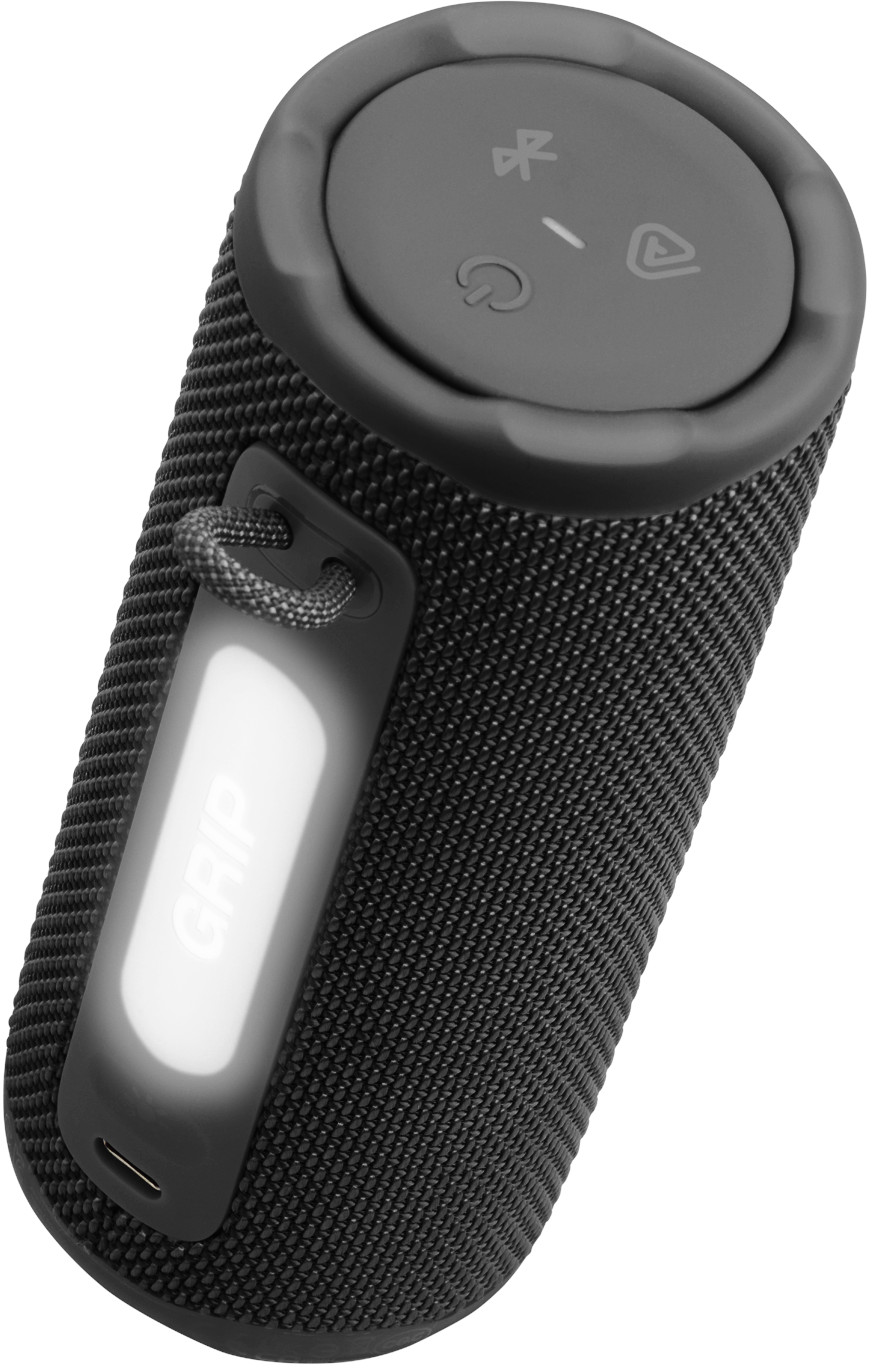 Haut-parleur cylindrique noir avec boutons supérieurs et une poignée 'GRIP' lumineuse. Dispose d'un port USB.