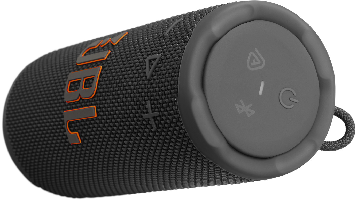 Haut-parleur JBL noir et gris. Logo JBL orange. Boutons gris pour l'alimentation, le bluetooth et le volume. Tissu noir.