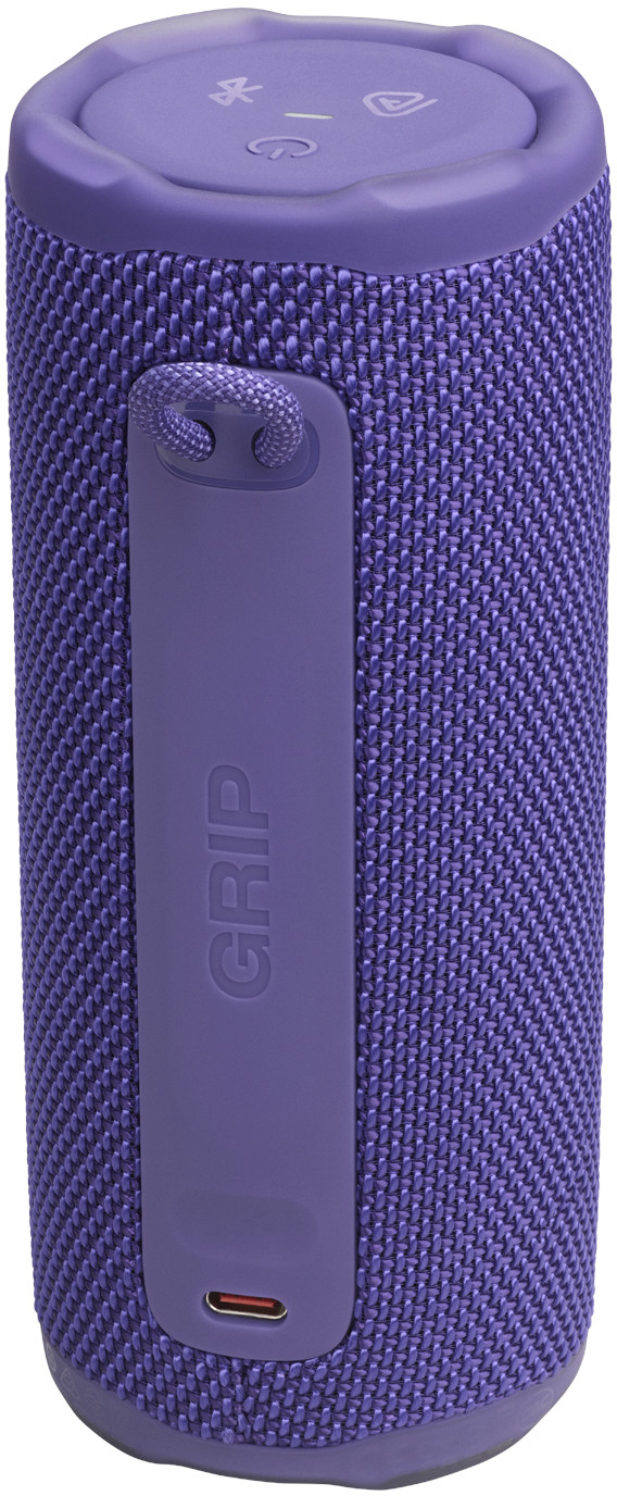 Un haut-parleur cylindrique violet. Il a une sangle et le mot 'GRIP' est imprimé sur le côté. Le dessus comporte des boutons.