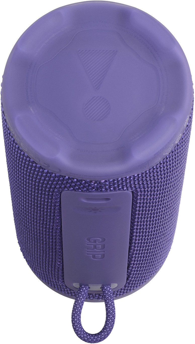 Un haut-parleur JBL violet. Il a un corps en maille, un dessus avec un triangle et un cercle, et une poignée avec une boucle.