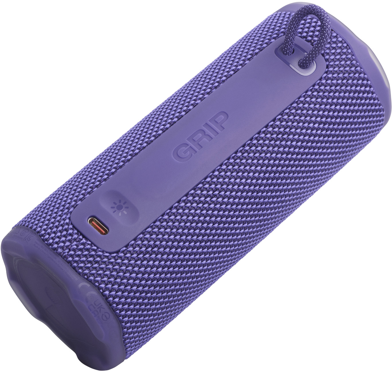 Un haut-parleur cylindrique violet. Il a un design en maille de tissu. Le mot 'GRIP' est imprimé sur une bande violette.