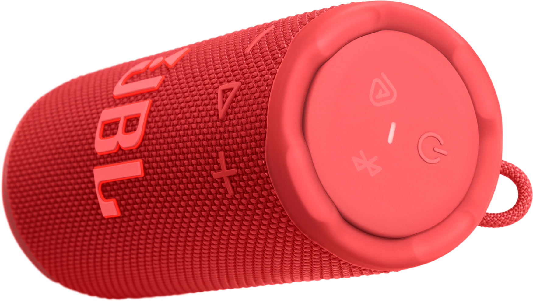 Un haut-parleur JBL rouge sur fond noir. Il a une surface texturée et des boutons de commande à l'extrémité.