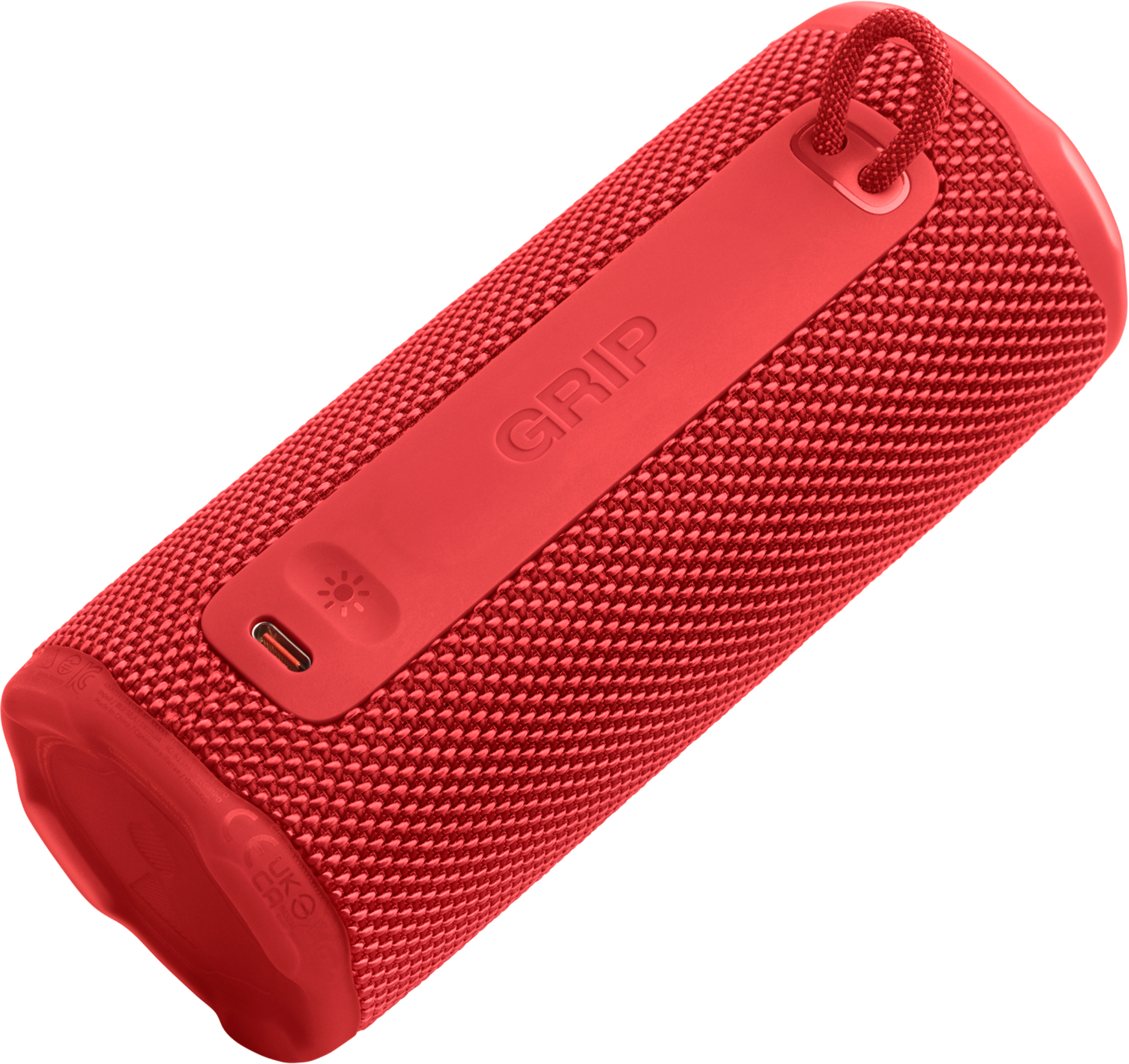 Haut-parleur cylindrique rouge avec le mot 'GRIP'. Il a une poignée, un port de charge et une texture en maille.