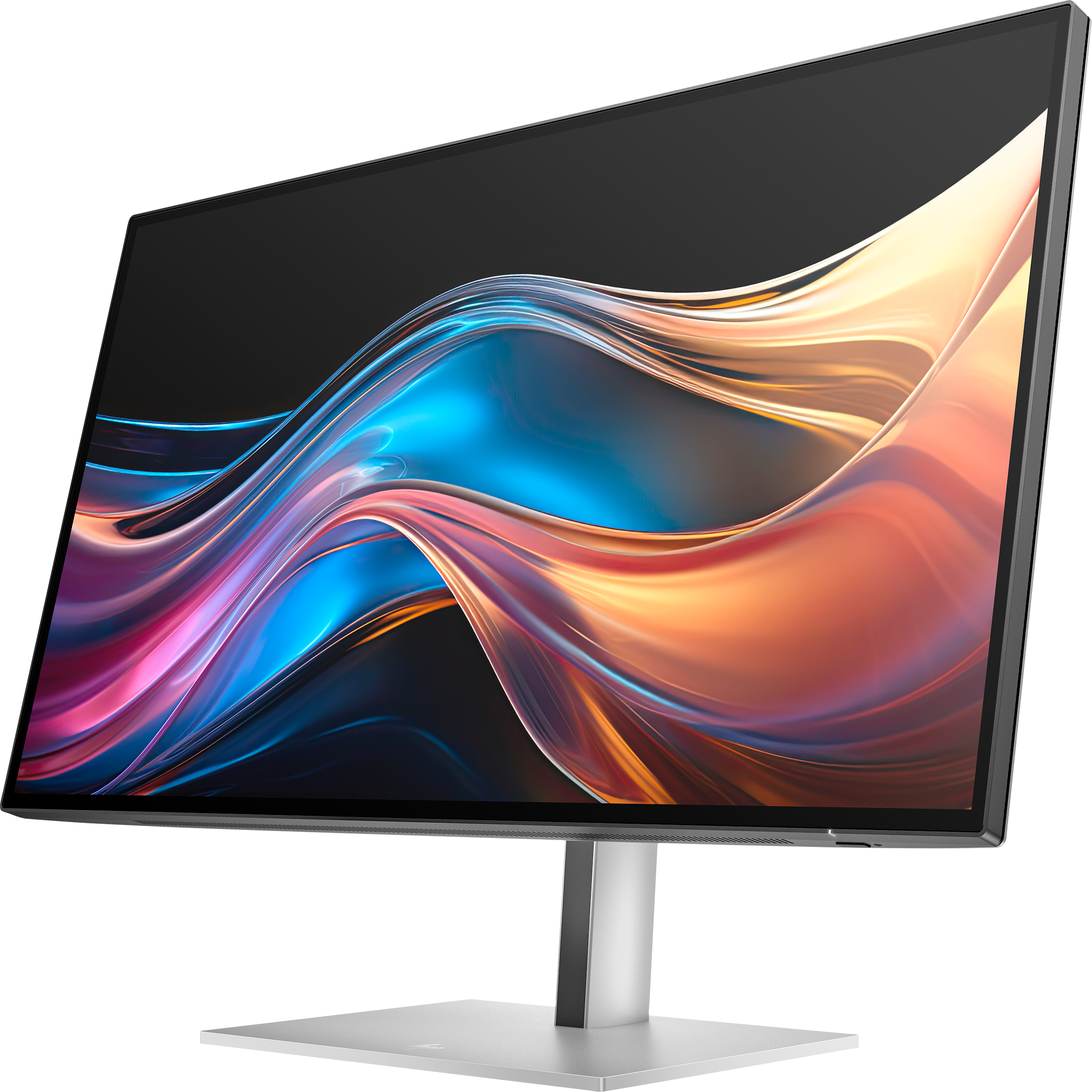 Un monitor di computer con supporto argentato. Lo schermo mostra un design astratto colorato su sfondo nero.