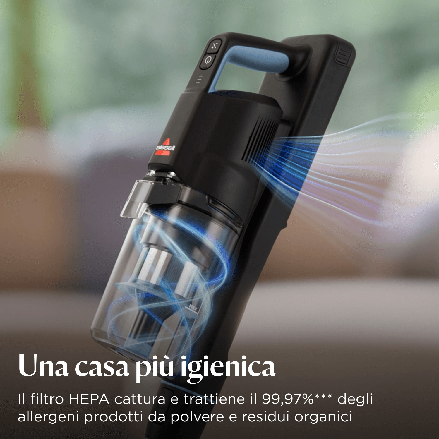 Aspirapolvere Bissell nero e blu. Ha un contenitore per la polvere trasparente, e il testo dice 'Una casa più igienica'.