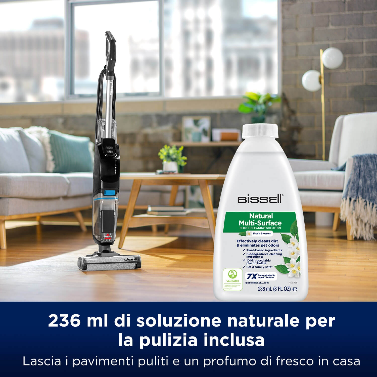 Un pulitore per pavimenti e aspirapolvere Bissell con una bottiglia di soluzione detergente. La bottiglia è bianca con testo verde e un design di fiori freschi.