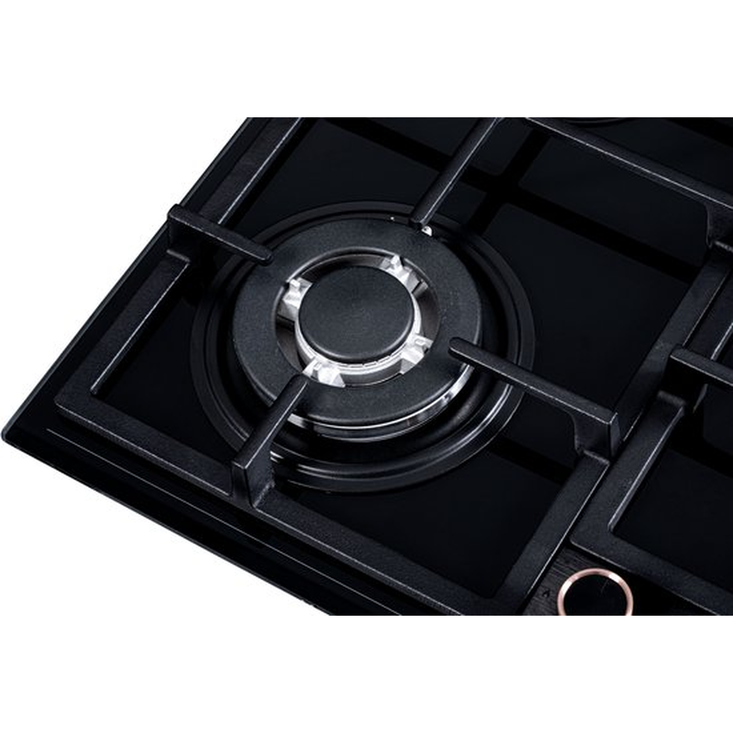 Close-up of a black stovetop. Four burners are visible, with a central burner in focus. The surface is glossy black.