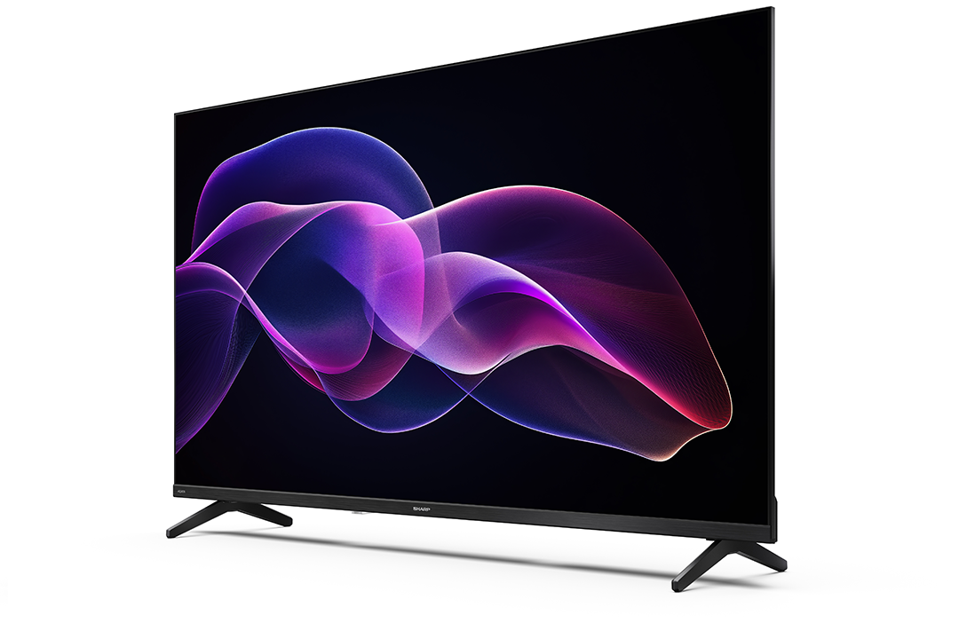 Egy modern Sharp TV fekete kerettel és állvánnyal, színes, absztrakt örvénymintát jelenít meg fekete háttér előtt.