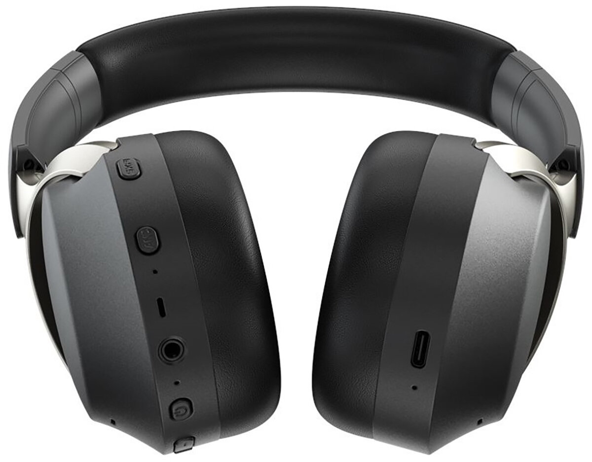 Czarne i szare słuchawki z wyściełanym pałąkiem. Na nausznikach znajdują się przyciski i porty. Widoczne srebrne akcenty.