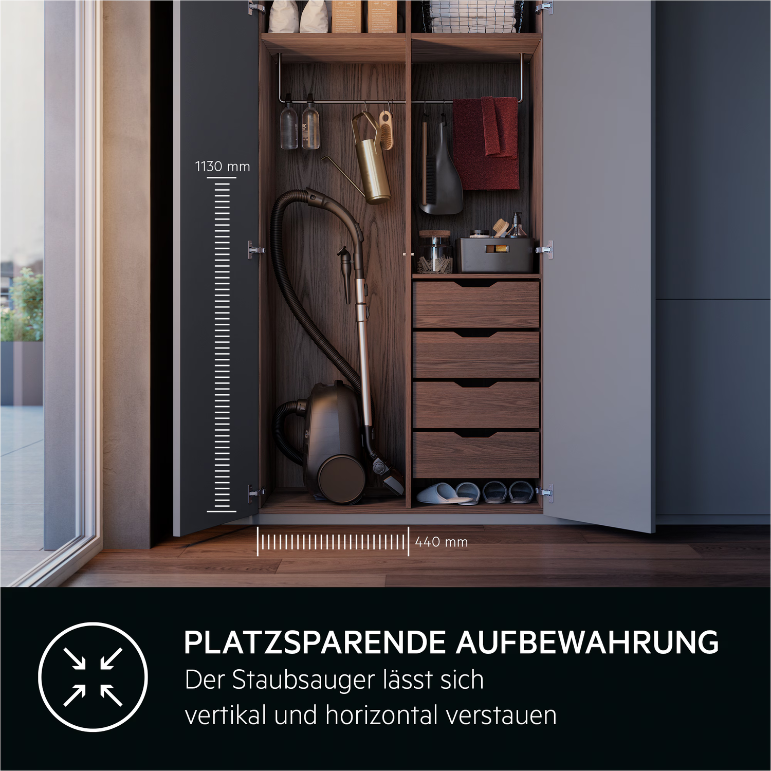 A dark cabinet open with a vacuum cleaner inside. Drawers and shelves are visible. The text at the bottom says 'Space-saving storage'.