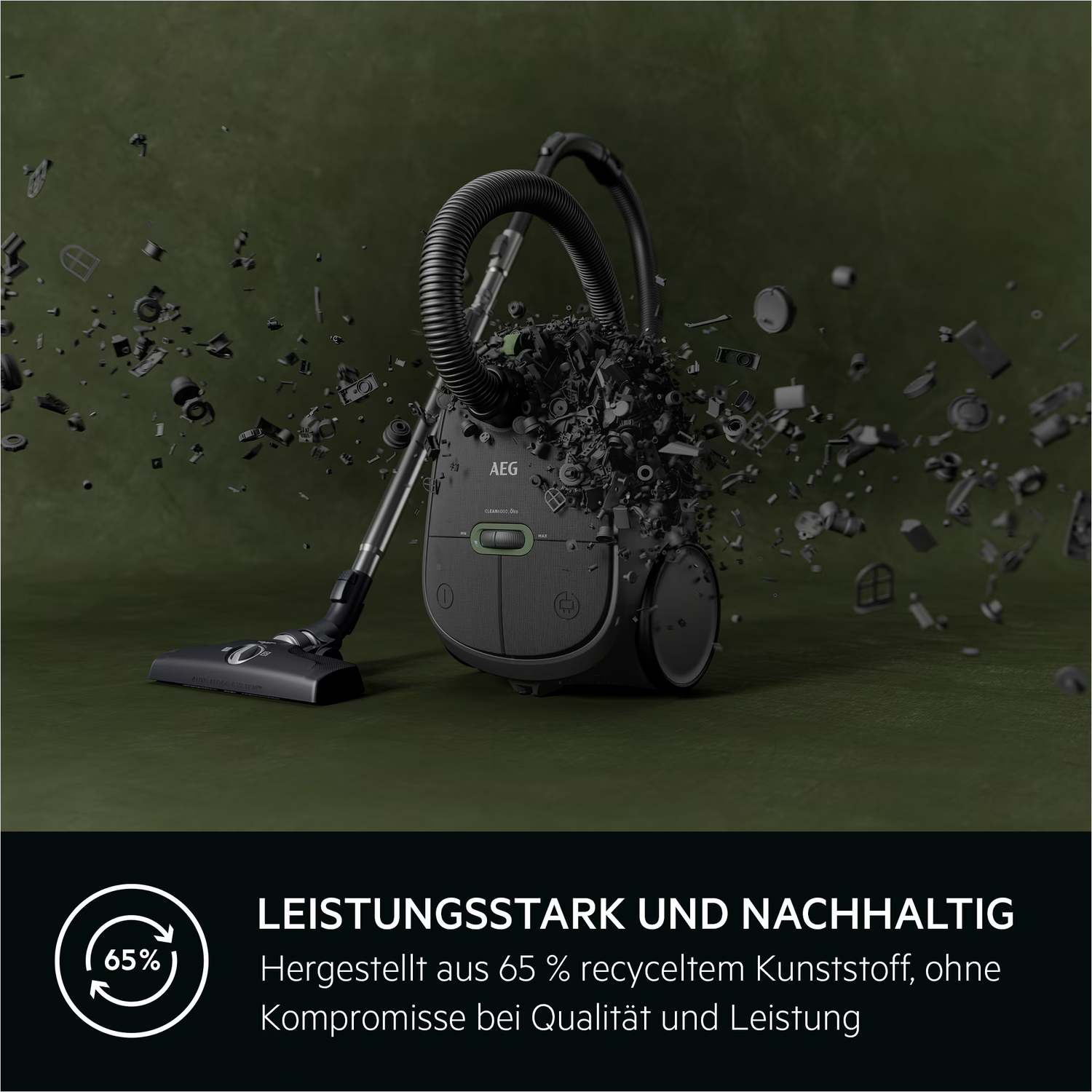 An AEG vacuum cleaner is surrounded by scattered debris, with text stating it's made of 65% recycled plastic.