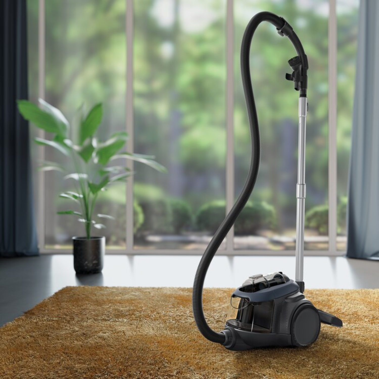 A black vacuum cleaner on a golden rug. A plant sits left. Window with green trees in the background. Curtains on both sides.