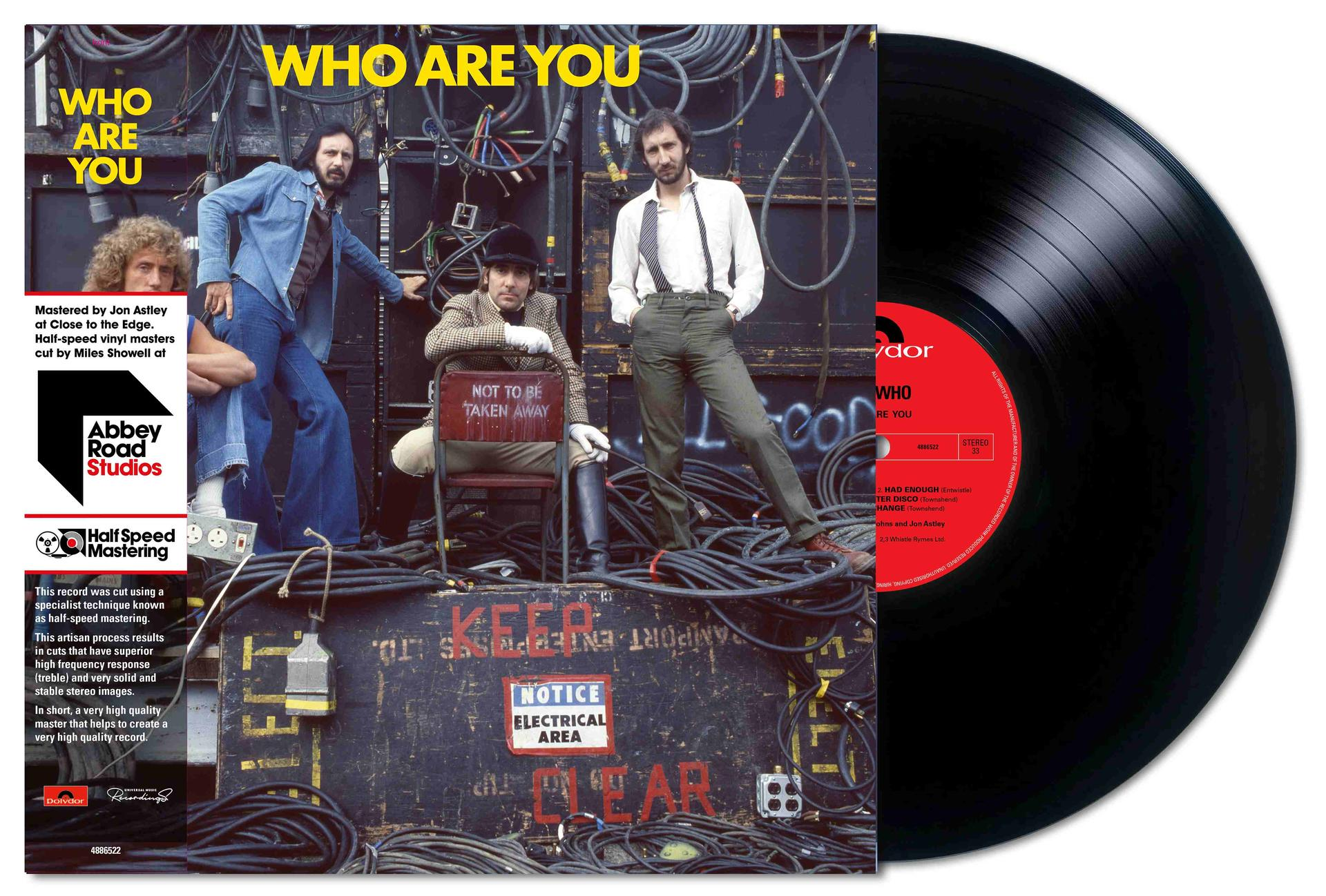 Albumcover von The Who's 'Who Are You'. Die Bandmitglieder posieren mit elektrischen Kabeln. Auf der rechten Seite ist eine Schallplatte.