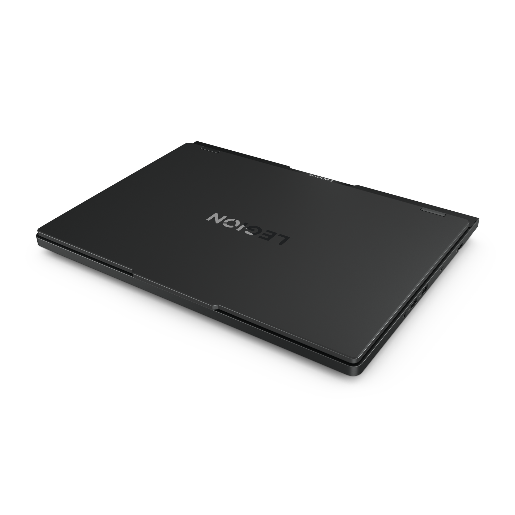 Ein schwarzer Lenovo Legion-Laptop ist geschlossen, auf schwarzem Hintergrund. Das Legion-Logo ist sichtbar.
