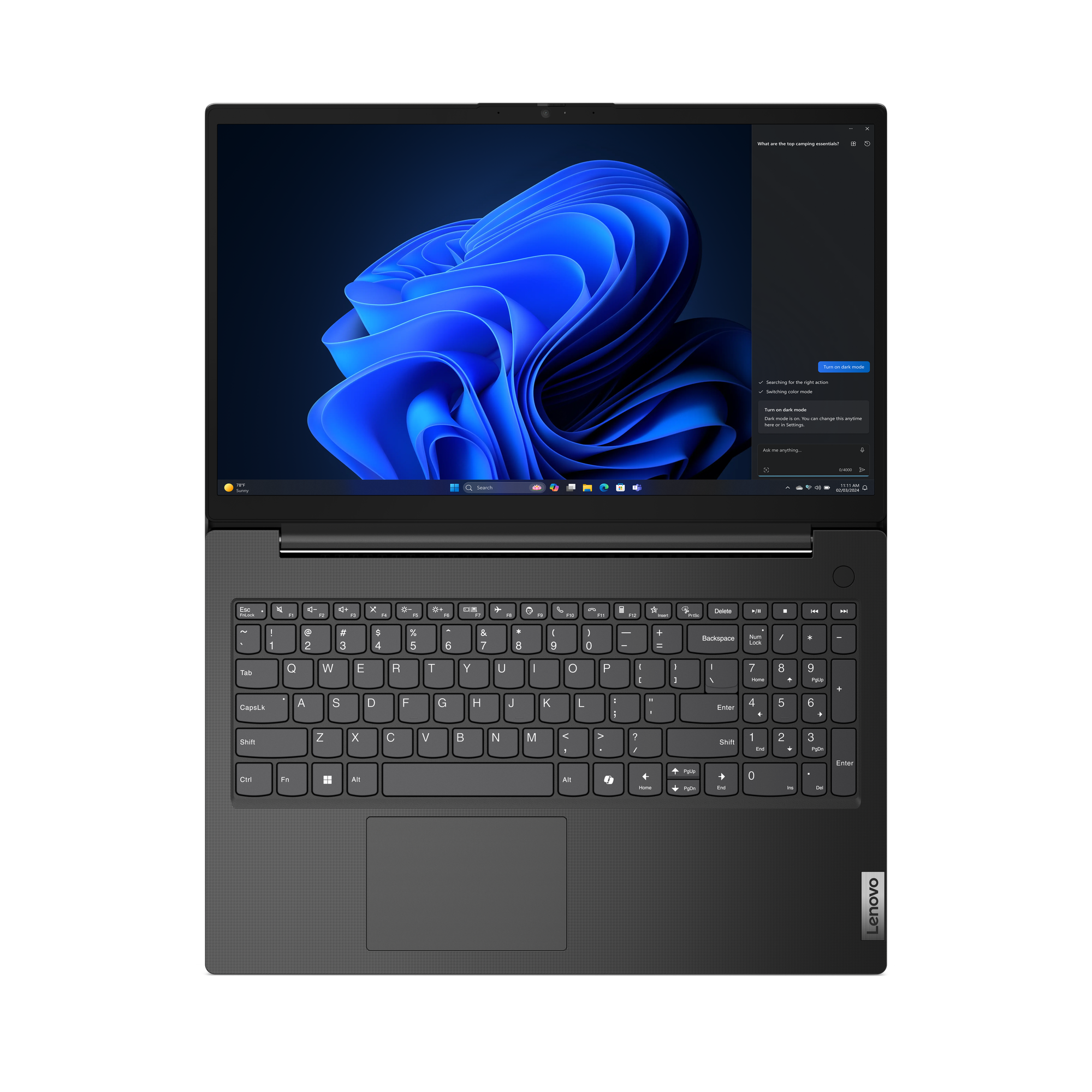 Ein Lenovo-Laptop ist geöffnet. Der Bildschirm zeigt ein blaues Wirbeldesign. Die Tastatur ist sichtbar.