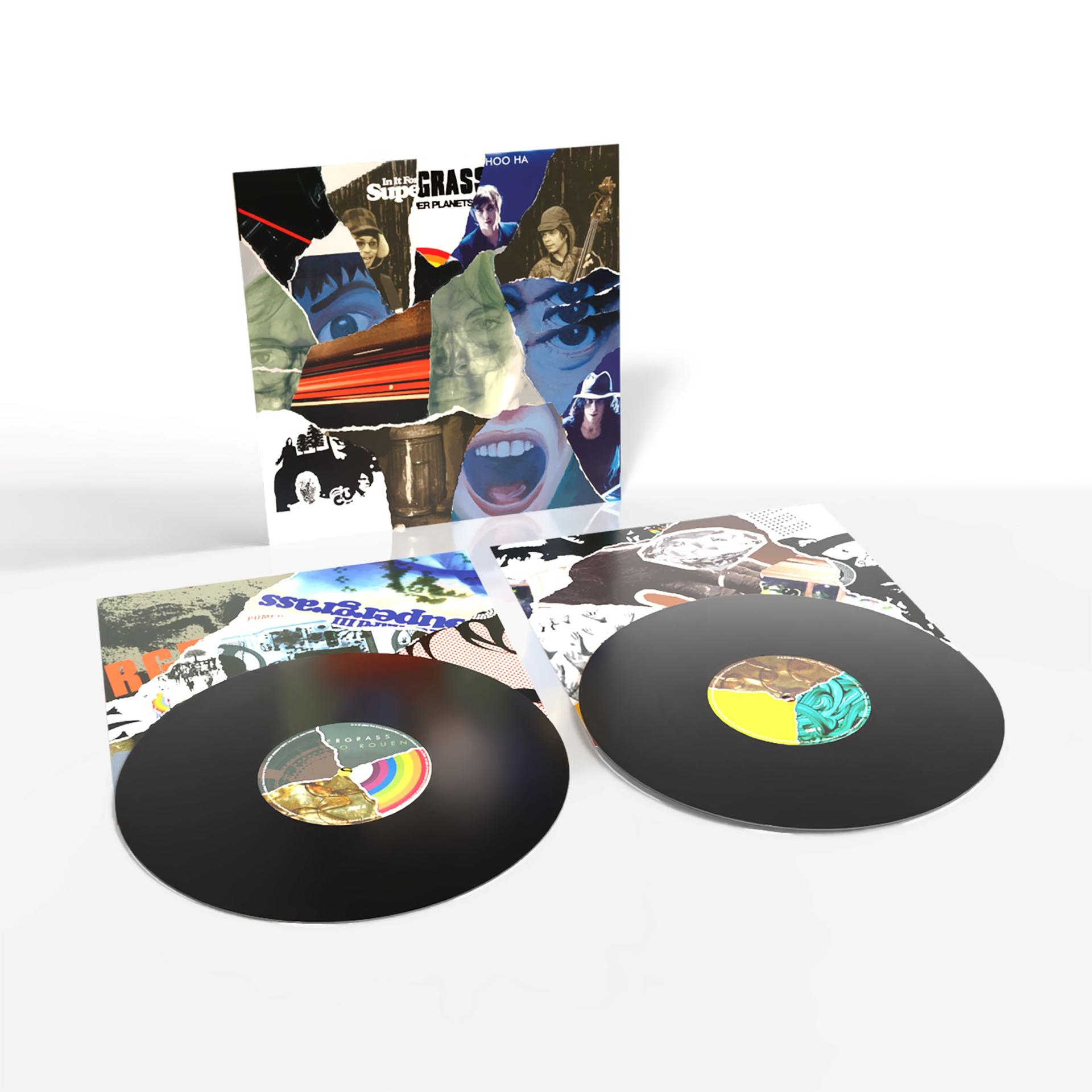 Vinylplatten mit Albumcover. Das Cover zeigt eine Collage aus Gesichtern und Text. Zwei schwarze Schallplatten sind auf weißem Grund zu sehen.