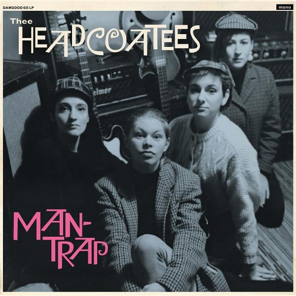 Albumcover von The Headcoatees. Vier Frauen posieren mit Hüten und Jacken vor Gitarren und Verstärkern. Titel: Man-Trap.