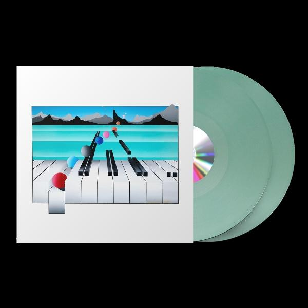 Albumcover mit Klaviertasten und farbigen Kugeln. Schallplatten sind rechts. Der Hintergrund zeigt Berge und Wasser.