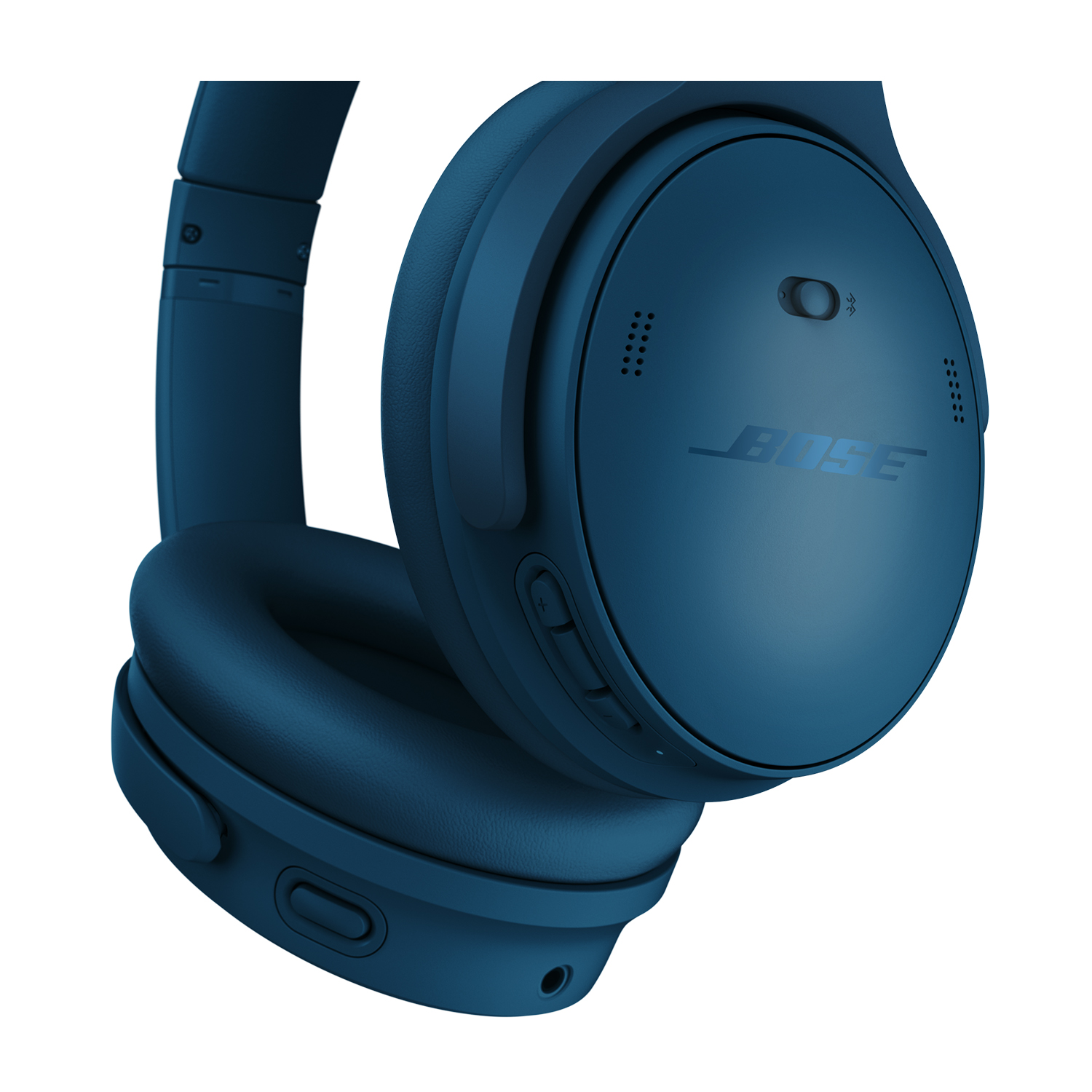 Primo piano delle cuffie Bose blu. Il padiglione sinistro e parte dell'archetto sono visibili su sfondo bianco.