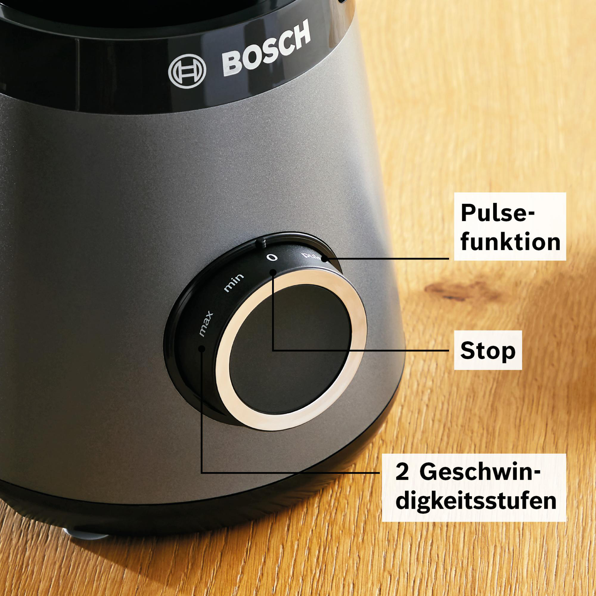 Ein grauer Bosch-Mixer mit einem Drehregler mit der Aufschrift min, max, 0 und Pulsfunktion, Stopp und 2 Geschwindigkeitseinstellungen.