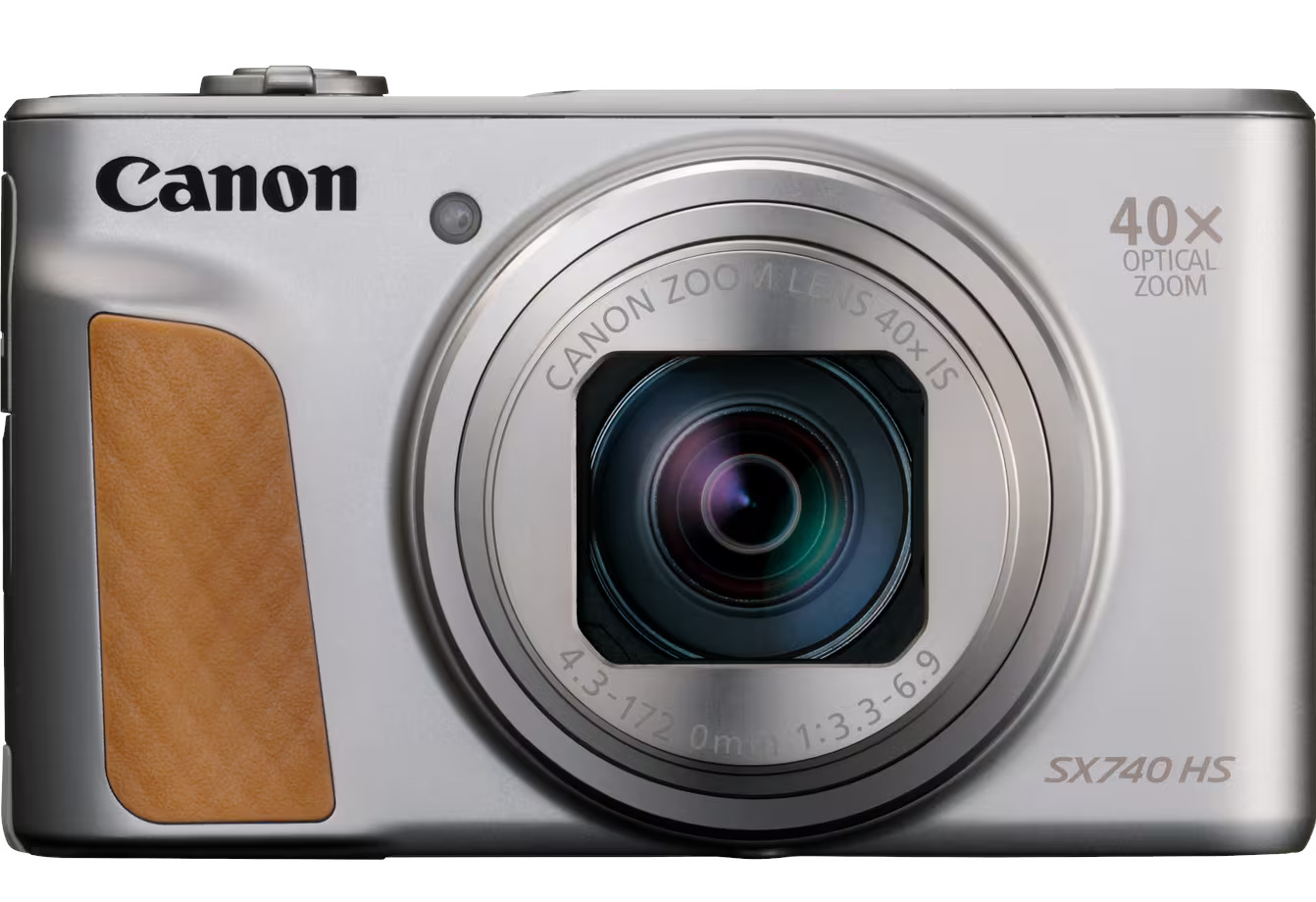 Srebrny aparat Canon SX740 HS. Posiada obiektyw, zoom optyczny 40x i brązowy uchwyt. Widoczne logo Canon.