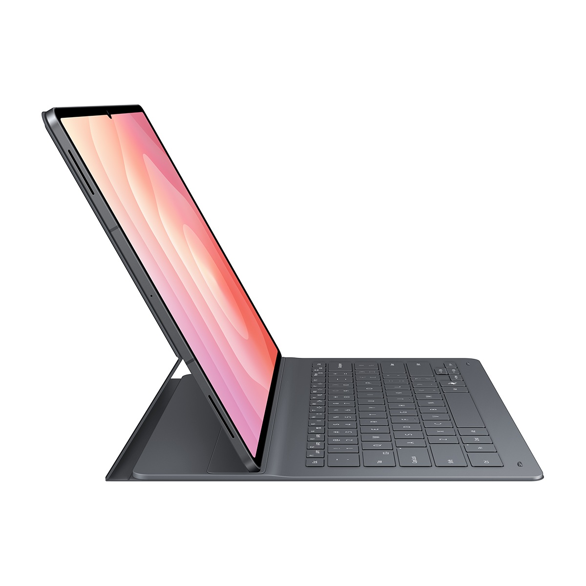 Klavye ile gri bir tablet açık, ekran pembe ve beyaz geçişler gösteriyor. Klavye takılı ve yukarı doğru açılı.