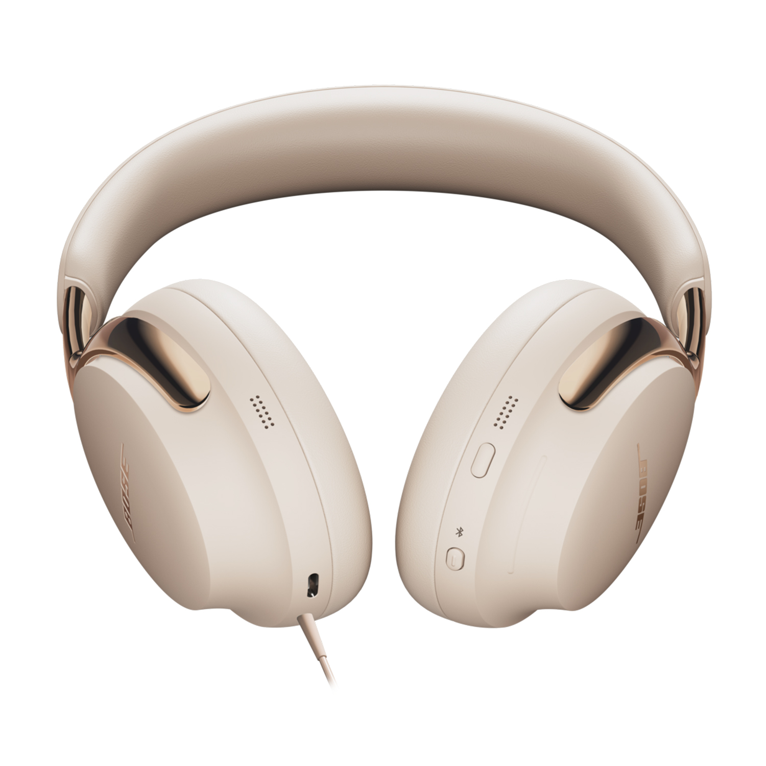 Cuffie Bose beige con dettagli dorati, pulsanti visibili e cavo collegato. Padiglioni e archetto sono visibili.