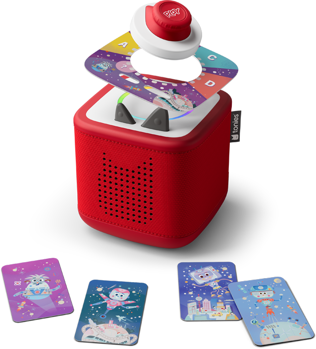 Giocattolo a cubo rosso con carte con illustrazioni a tema spaziale. Un disco bianco con un pulsante rosso sopra. Vengono mostrate varie carte.