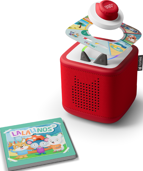 Una scatola audio rossa con un pulsante play e un tabellone di gioco circolare. Un libro con animali dei cartoni animati è davanti.