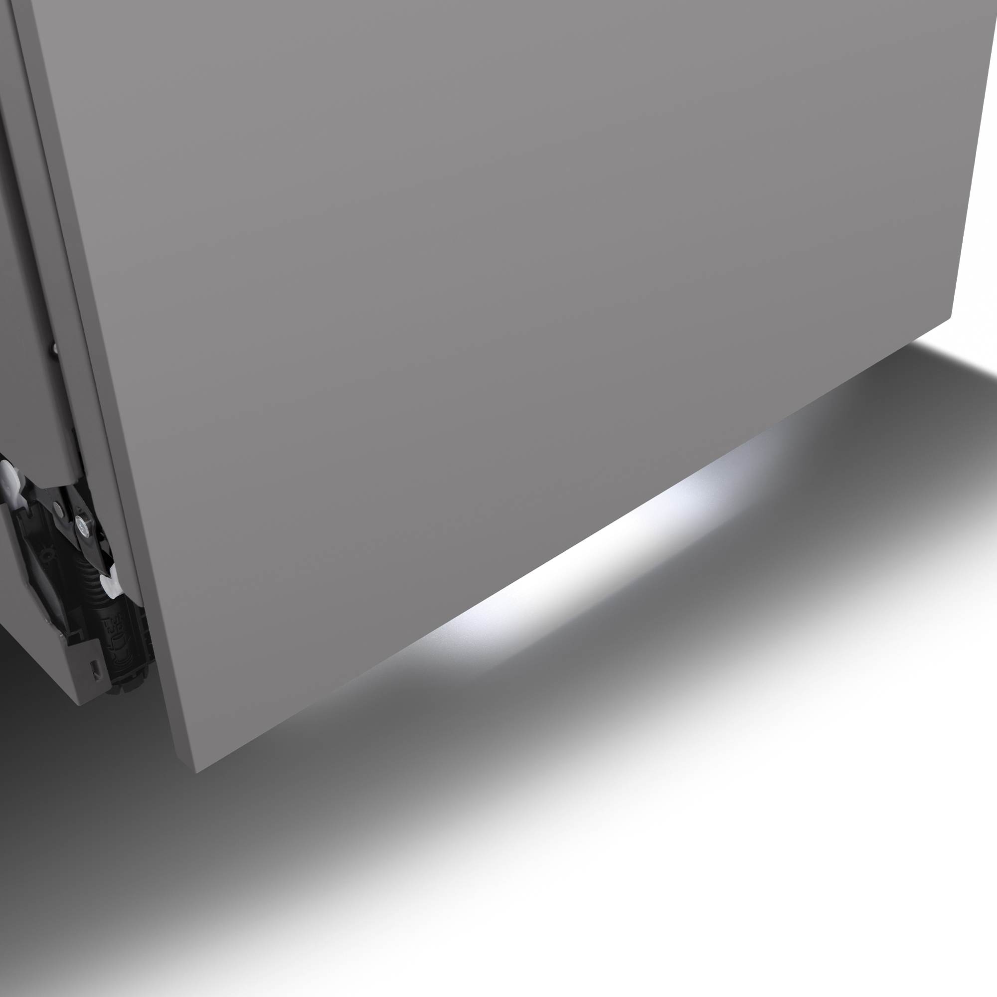 Primer plano de una esquina de armario gris con su hardware mecánico visible, iluminado desde abajo, proyectando una sombra.